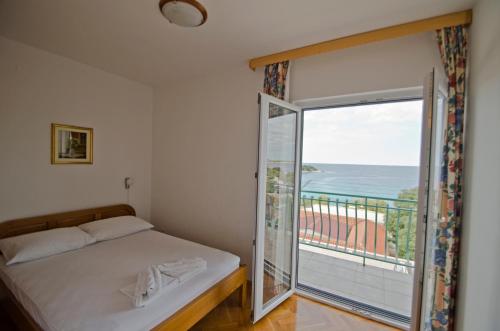 Postel nebo postele na pokoji v ubytování Buntin Apartments