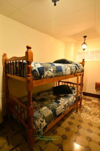 two bunk beds in the corner of a room at EVA & TRAVEL - El Cor del Montsant in Ulldemolins