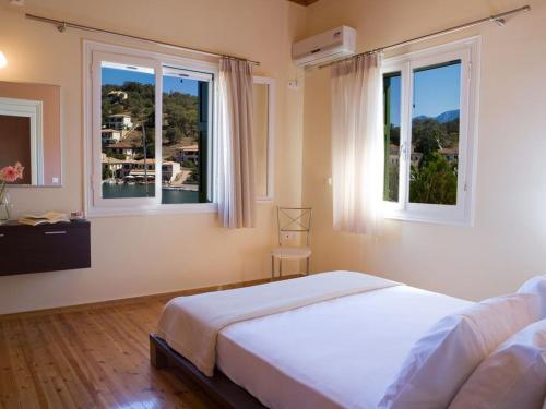 Ένα ή περισσότερα κρεβάτια σε δωμάτιο στο C. Katopodis Mansion