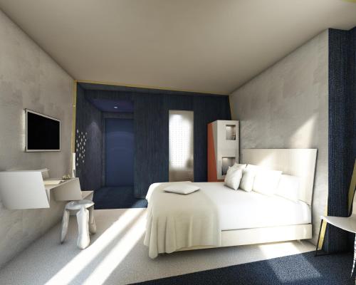 パリにあるル マローンのベッドルーム(白いベッド1台、テレビ付)