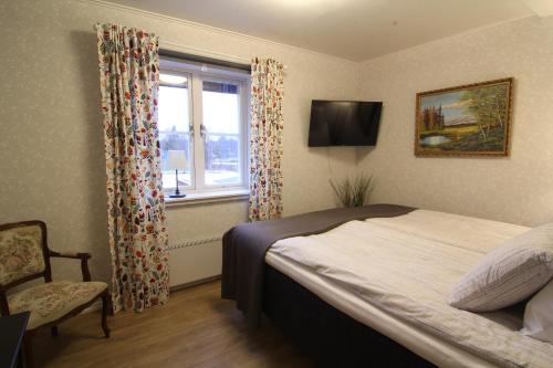 מיטה או מיטות בחדר ב-Filipsborg, the Arctic Mansion