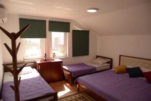 Postel nebo postele na pokoji v ubytování Hostel Tuba
