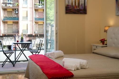 a bedroom with a bed and a view of a balcony at Gregory House in Rome