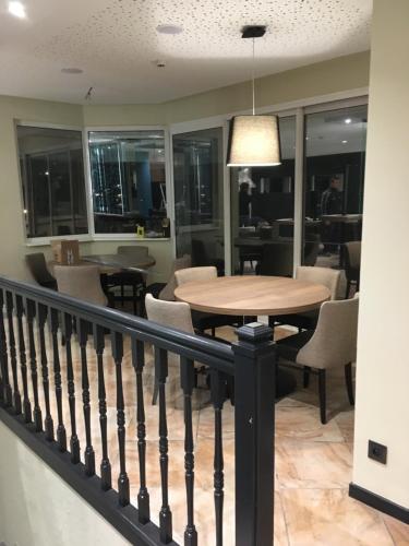 a dining room with a table and chairs at Hotel Restaurant au Floridor in Thann