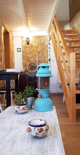 a blue blender sitting on a table in a room at Casa Marreiros Holiday Home in Vila do Bispo