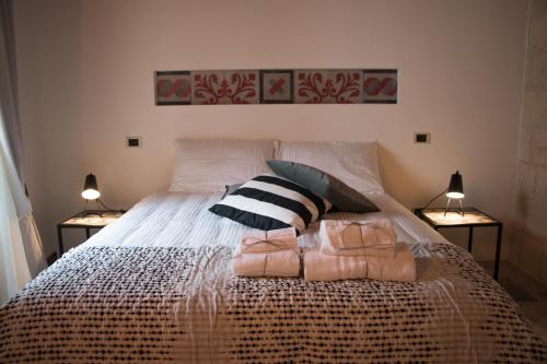Кровать или кровати в номере Cece Nove - Sotto l'Arco
