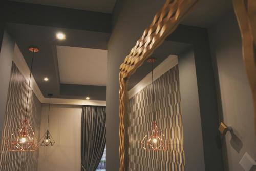 a room with two chandeliers and a rope hanging from the ceiling at Hotel Roma Vaticano in Rome