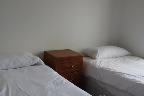 Кровать или кровати в номере Welltrees Apartments 8 Dailly Road