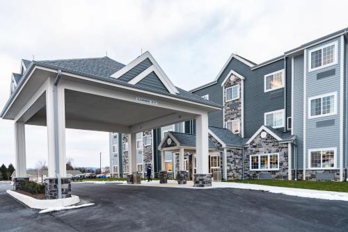 a large building with a parking lot in front of it at Microtel Inn & Suites by Wyndham Carlisle in Carlisle