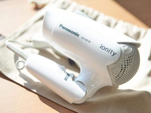a white hair dryer sitting on top of a table at Super Hotel Mihara Ekimae in Mihara