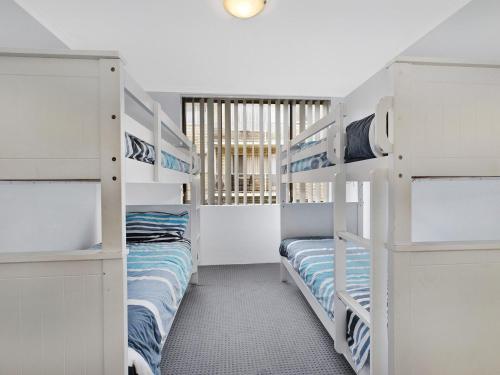 Ένα ή περισσότερα κρεβάτια σε δωμάτιο στο Sundowner Apartment 9