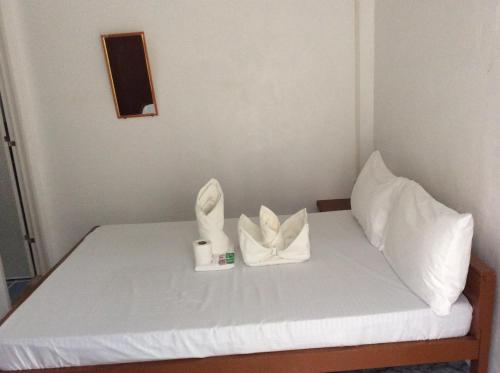 Кровать или кровати в номере Bucana beachfront guesthouse