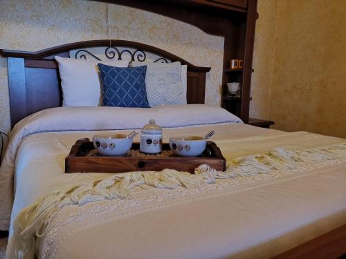מיטה או מיטות בחדר ב-Casa vacanze Richi&Michi Chia