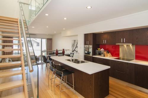 a kitchen with a large island in the middle at 16 Seine Bay Apartment in Augusta