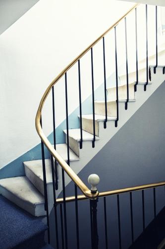 a set of stairs in a house at The Old Hotel Ravel Centre in Clermont-Ferrand