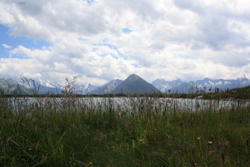 a large body of water with mountains in the background at Hotel Neuwirt in Finkenberg