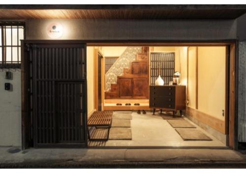 an entrance to a house with a door and a table at Minato-ku - House / Vacation STAY 12127 in Tokyo