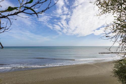 a view of the ocean from a beach at Faros BeachFront Villa in Pervolia