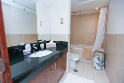 Ванная комната в Prime Retreats - Downtown Dubai