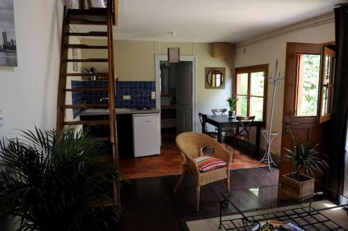 a living room with a kitchen and a dining room at B&B Chez Marie in Beaune