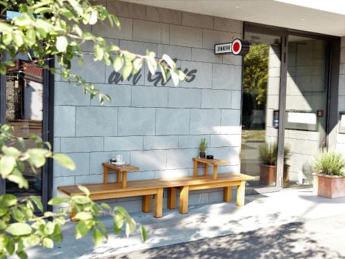 two benches sitting on the side of a building at Radhotel am Gleis in Radolfzell am Bodensee