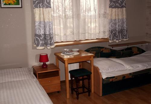 Postel nebo postele na pokoji v ubytování Bar Malwa
