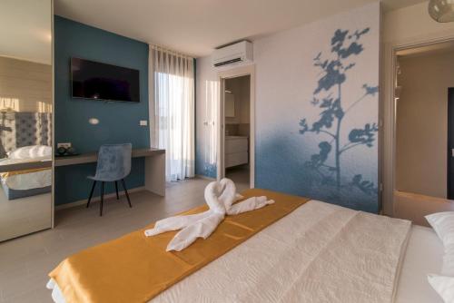 a bedroom with a towel animal sitting on a bed at Luxury Villa Viktorija in Krk