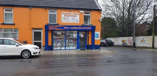 a white car parked in front of a store at Small Town House, Barrow Lane, Bagenalstown, Carlow in Bagenalstown
