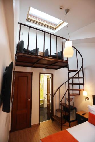 a room with a loft bed and a room with a bed at Anjo Azul in Lisbon