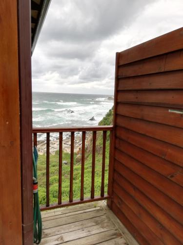 a view of the ocean from the porch of a house at Shick-Shack in Eersterivierstrand