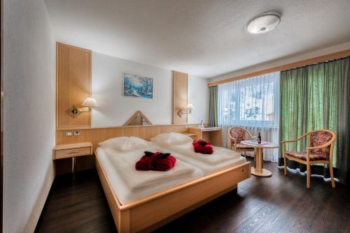 Postel nebo postele na pokoji v ubytování Wellness- und Schneesporthotel Christiania