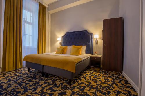 a hotel room with a bed and a window at Hotel Gamla Stan, BW Signature Collection in Stockholm