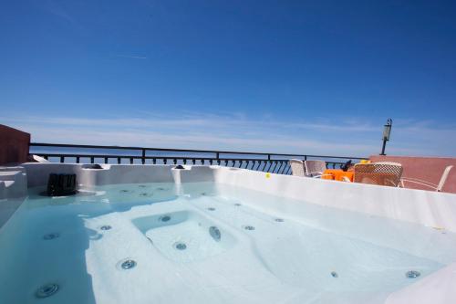 a hot tub sitting on top of a roof at panoramic sea view house in Tučepi