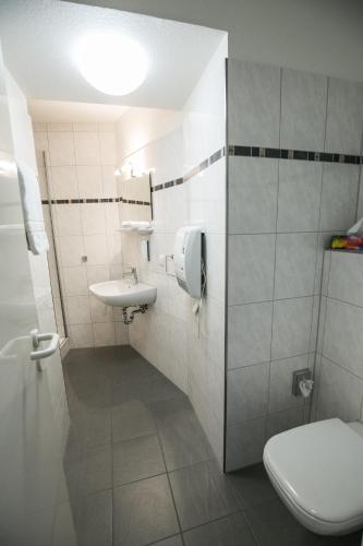 a bathroom with a toilet and a sink at Bürgermeisterkapelle in Hildesheim
