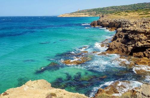 a view of the ocean from a cliff at Villa Alkaram de lujo con vistas panorámicas al mar in Zahara de los Atunes
