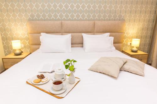 Postel nebo postele na pokoji v ubytování Hotel Baron