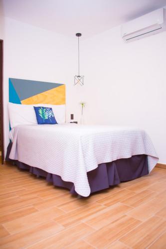 Ένα ή περισσότερα κρεβάτια σε δωμάτιο στο Hotel Citlalli