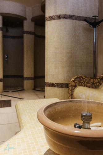 a bathroom with a sink in a room at Ostrova Holiday Village in Beli Osŭm