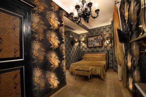 a bedroom with a bed and a stone wall at Ca' Pagan in Venice