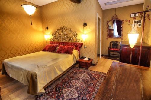 a bedroom with a large bed and a rug at Ca' Pagan in Venice