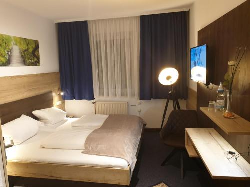 Postel nebo postele na pokoji v ubytování Hotel Wacker