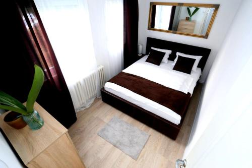 Tempat tidur dalam kamar di Apartman City Lux