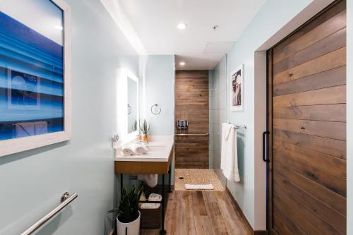 
a bathroom with a sink and a toilet at Surfhouse in Encinitas
