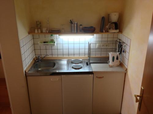 Кухня или мини-кухня в Pension Winkel
