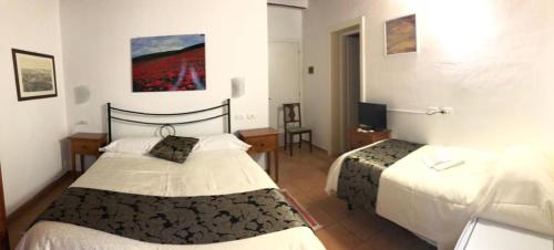 Postel nebo postele na pokoji v ubytování Villa Tuscany Siena