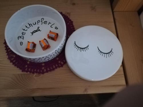 two plates with eyes on them sitting on a table at Schmaranzer in Bad Ischl