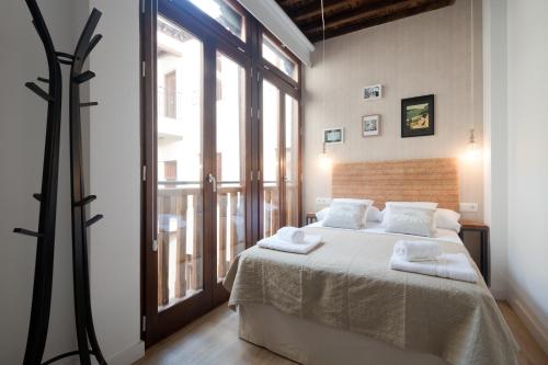 Ένα ή περισσότερα κρεβάτια σε δωμάτιο στο Casas del Albaicín