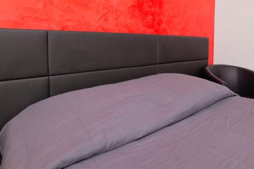 Ένα ή περισσότερα κρεβάτια σε δωμάτιο στο Motel D'ornex