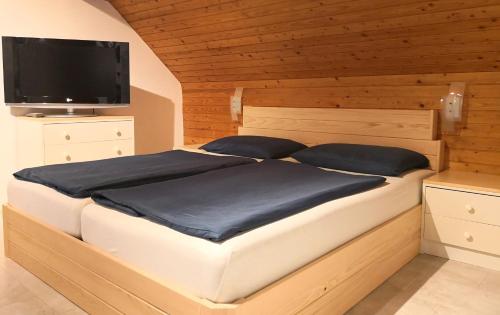 A bed or beds in a room at Apartments Silič