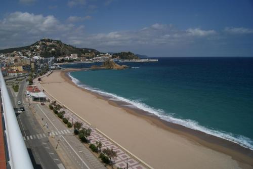 a view of a beach and the ocean at Apartaments El Sorrall in Blanes